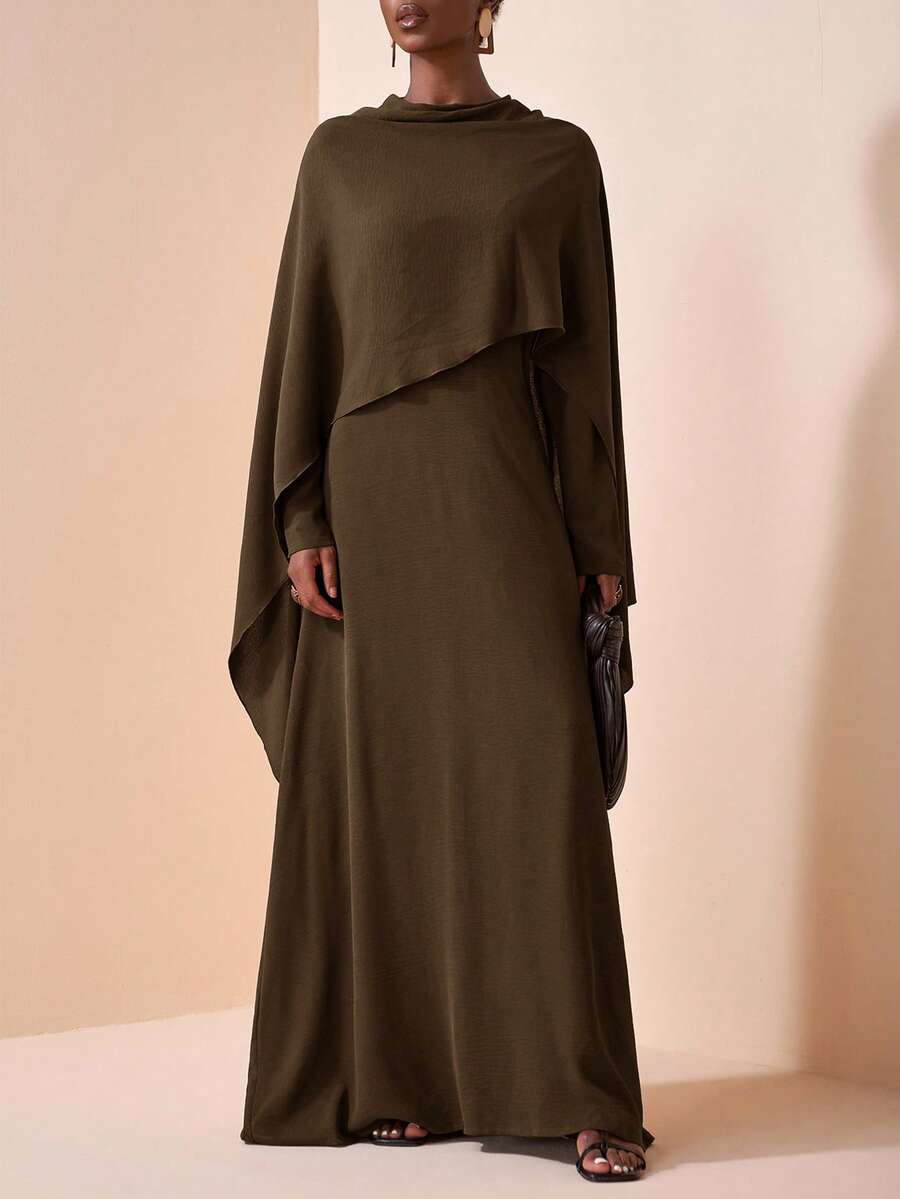 Wrap yourself in winter elegance with this stunning two-piece set that's ready for any occasion! The rich dark brown dress features a flattering round neckline, while the flowing cape adds a touch of dramatic flair and sophistication. Perfect for holiday parties, gatherings, and special events, this versatile combo lets you mix and match for endless styling possibilities. Whether you're dressing up for a night out or layering for warmth, you'll feel absolutely fabulous. Cozy, chic, and undeniably show-stopp