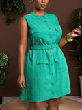 Step into spring and summer with this playful yet elegant dark green sleeveless mini shirt dress. Designed for plus sizes, it features a chic mandarin collar and a flattering belt to accentuate your waist. Perfect for warm days, this dress combines comfort with a trendy silhouette, making it a versatile addition to your seasonal wardrobe.