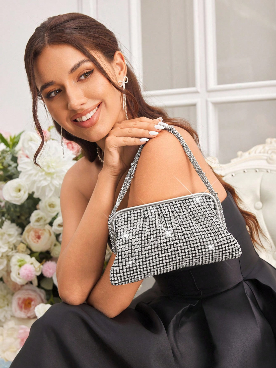 Sparkle through the night with this dazzling diamond-studded evening clutch! Perfect for those moments when you want to turn heads, this glitzy accessory transforms any outfit into red-carpet worthy glamour. The elegant design pairs effortlessly with formal wear, while the shimmering embellishments catch light from every angle. Compact yet spacious enough for your essentials, it's the ultimate finishing touch for galas, parties, and special occasions. Make a statement that says you don't do ordinary.