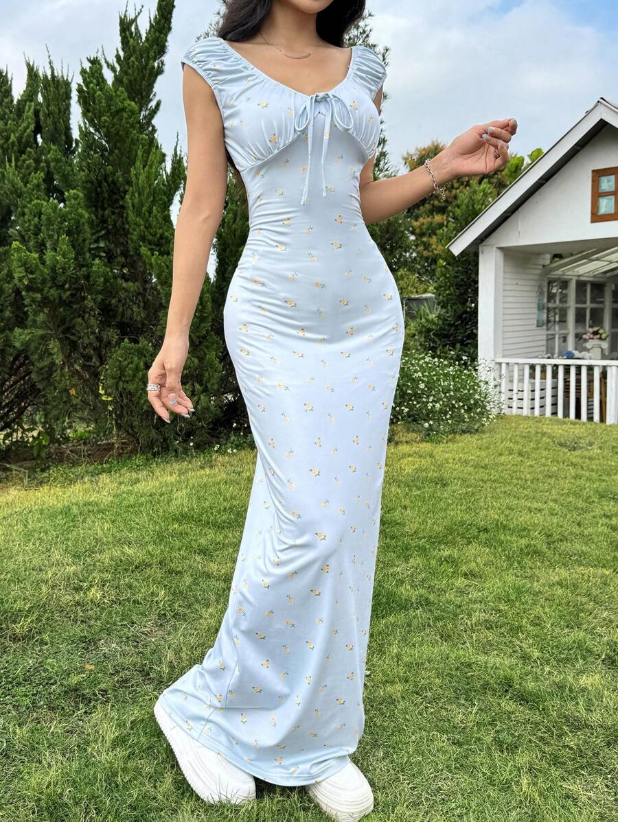 Get ready to turn heads on your next summer beach vacation with our Elegant Ditsy Floral Maxi Dress! Featuring a beautiful floral print and a flattering maxi length, this dress will make you feel both elegant and carefree. Perfect for any beach destination, this dress is the must-have outfit for your summer getaway.