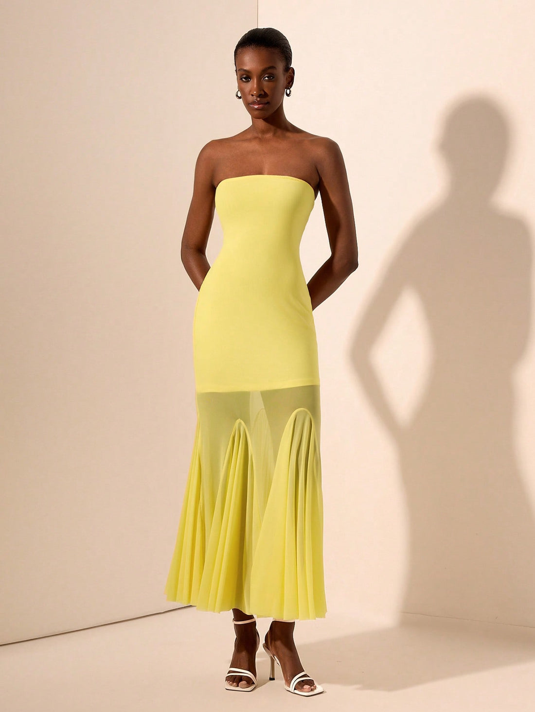 Turn heads in this playful yellow strapless mermaid maxi dress, designed to dazzle all night long. Featuring a unique knit texture and sheer mesh accents, it perfectly blends elegance with an edgy vibe. The figure-hugging silhouette flatters your curves while the vibrant yellow hue adds a burst of sunshine to your evening look. Ideal for making unforgettable entrances and sparkling under the lights.
