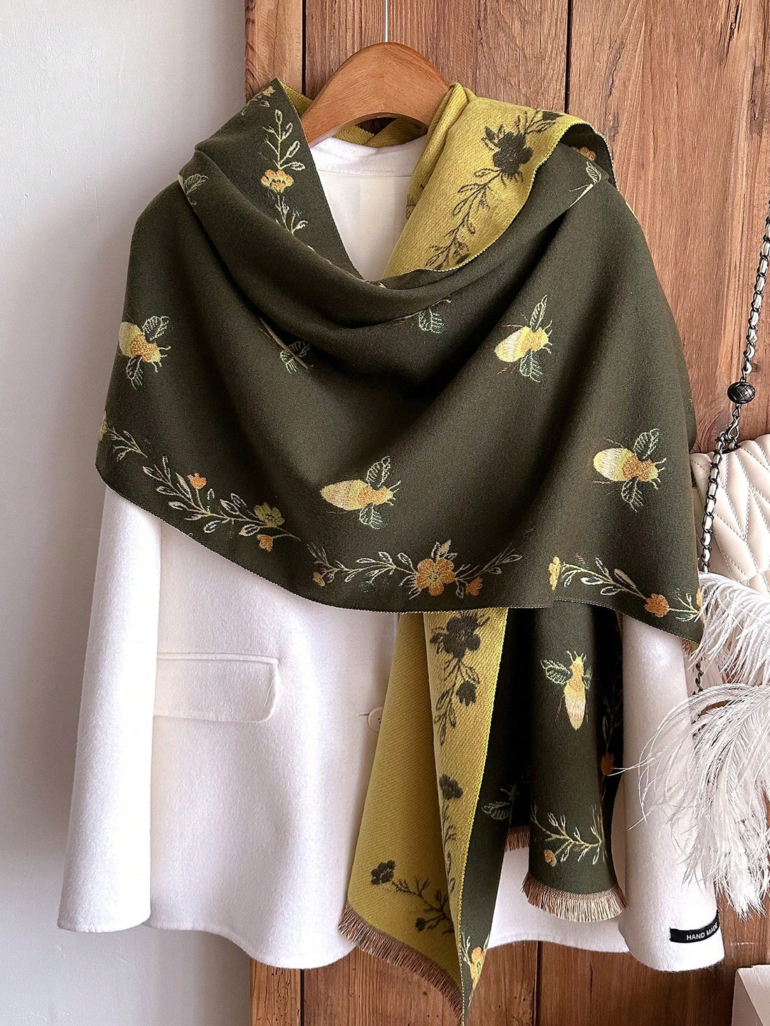 Introducing our elegant floral and bee jacquard faux cashmere scarf, the perfect accessory for chic warmth. Featuring intricate floral and bee designs woven into luxurious faux cashmere, this scarf is perfect for any woman looking to elevate her style while staying cozy.