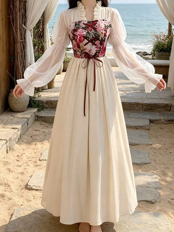 Front view of apricot floral corset renaissance maxi dress with ivory skirt