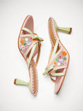 Overhead view of blush mint floral mesh mule heels with bow and flared heel