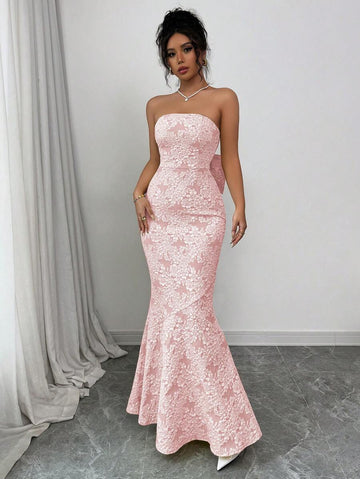 Turn heads at your next special event in this stunning strapless fish tail dress! Featuring intricate floral embossing that catches the light beautifully, paired with a show-stopping butterfly back detail that's pure magic. The elegant silhouette hugs your curves in all the right places, while the dramatic fishtail hem adds that extra touch of glamour and movement. Perfect for galas, weddings, or any occasion where you want to feel absolutely fabulous. This dress isn't just an outfit—it's your moment to shi