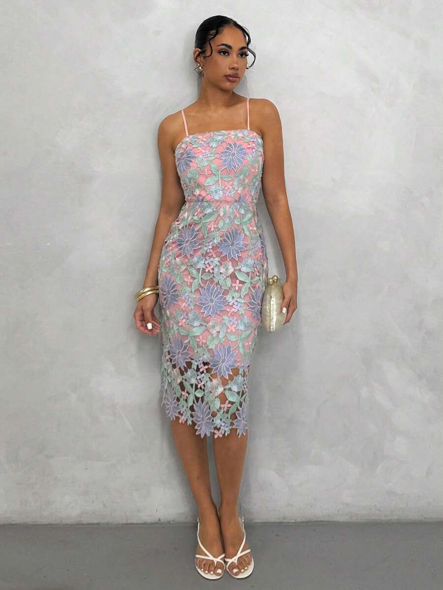 Elevate your wardrobe with this stunning floral guipure lace overlay cami dress. Featuring delicate embroidered details and an all-over botanical print, this knee-length piece combines elegance with versatility. The high-waist silhouette and spaghetti straps create a flattering, refined look perfect for beach outings, concerts, or festive celebrations. Crafted from 100% polyester with slight stretch for comfort, the lined bodice ensures a polished appearance. A convenient zipper closure adds practicality to