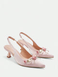 Step into elegance with these stunning floral high heels, designed for women who want to make a lasting impression. Featuring a delicate pointed toe and graceful mid-height pyramid heel, these slingback pumps offer the perfect balance of comfort and sophistication. Crafted from luxurious satin with a soft PU leather lining, these baby pink beauties are adorned with charming floral details and a feminine bow accent. Ideal for summer weddings, graduations, and special occasions.