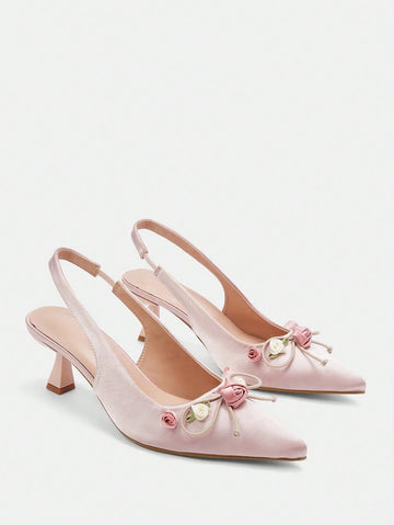 Step into elegance with these stunning floral high heels, designed for women who want to make a lasting impression. Featuring a delicate pointed toe and graceful mid-height pyramid heel, these slingback pumps offer the perfect balance of comfort and sophistication. Crafted from luxurious satin with a soft PU leather lining, these baby pink beauties are adorned with charming floral details and a feminine bow accent. Ideal for summer weddings, graduations, and special occasions.