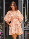 Turn heads this summer with our Elegant Floral Low V-Neck Puff Sleeve Mini Dress, perfect for beach getaways. Its playful puff sleeves and flirty low V-neck add a touch of charm, while the floral print keeps the vibe fresh and fun. Lightweight and breezy, this mini dress moves with you for all your seaside adventures. Embrace sunny days in style and make every moment feel like a vacation!