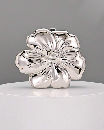 Elevate your evening with this stunning floral metal clutch bag, designed for those unforgettable moments. Crafted from premium PMMA with elegant ironmongery details, this mini box bag features a glamorous silver finish that catches the light beautifully. Perfect for weddings, parties, and special occasions, it combines luxury with practicality. The compact size fits essentials while making a sophisticated statement. An ideal accessory for anyone seeking refined elegance and timeless style.