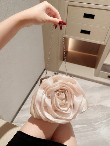 Step into elegance with our Floral Pearl Clutch Bag - the perfect accessory for weddings and evening events. This stunning bag features intricate floral detailing and pearls, adding a touch of sophistication to any outfit. Impress with style and grace.