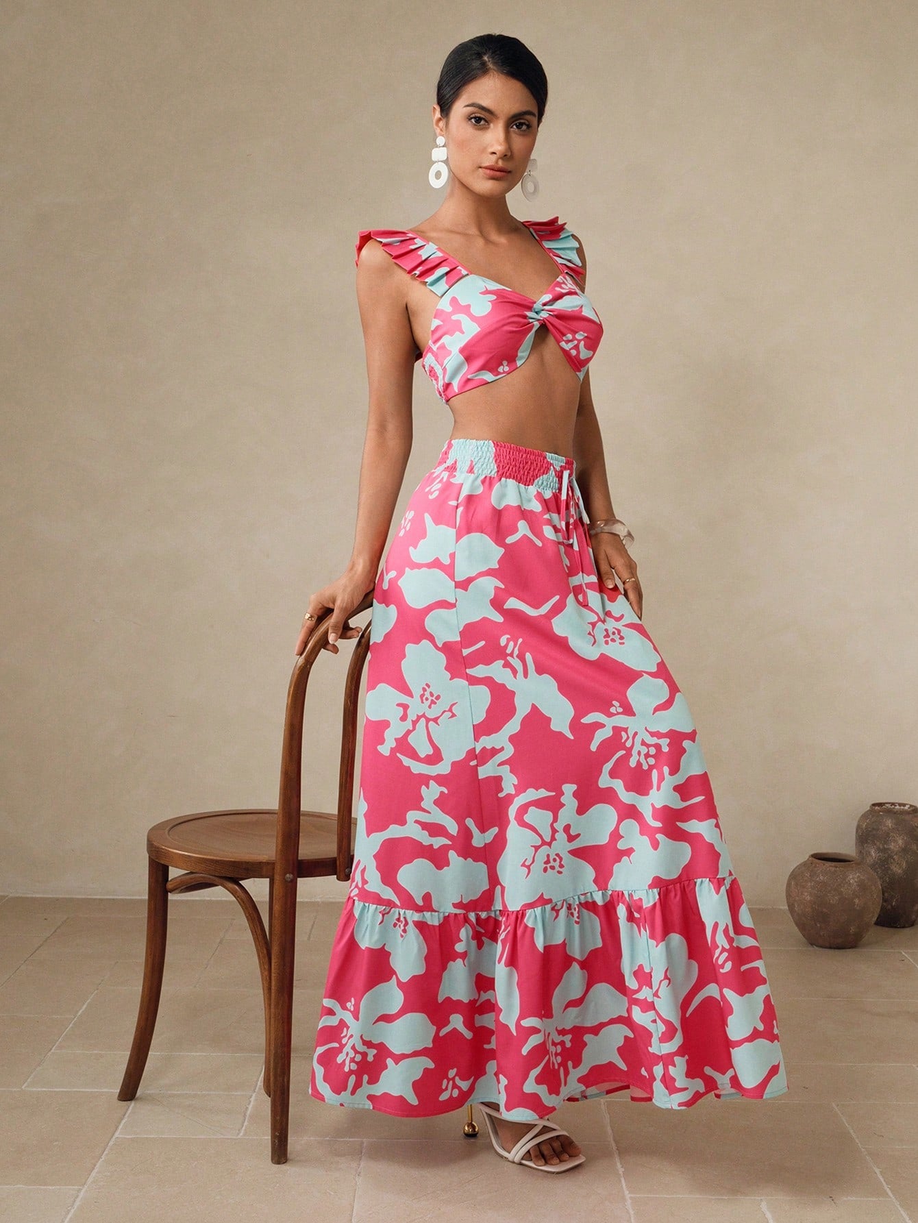 Make a splash with confidence in this charming two-piece swim set! Featuring a vibrant floral print that brings tropical vibes to poolside style, this set pairs a flattering crop top with a playful ruffle-hem skirt for a fun, feminine look. The coordinated design creates an effortlessly put-together appearance, while the skirt's ruffled detail adds movement and flair. Perfect for beach days, pool parties, or vacation getaways, this set lets you express your style while enjoying the water. Mix, match, and ha