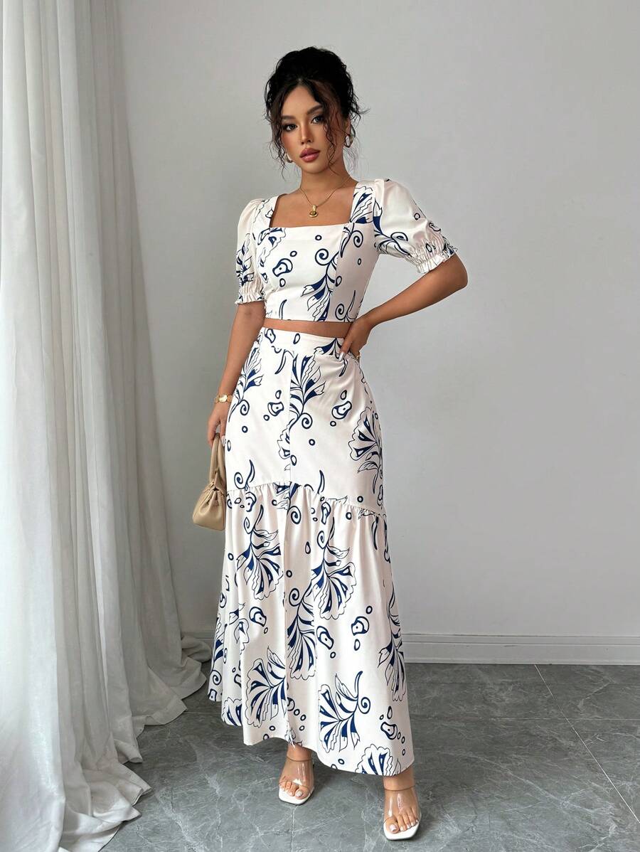 Bloom into effortless style with this charming 2-piece set! The short-sleeve floral shirt pairs perfectly with a graceful slit-hem skirt, creating a look that's equal parts vacation-ready and everyday fabulous. Whether you're sipping cocktails by the pool or running errands around town, this set delivers comfort and elegance in one gorgeous package. The vibrant floral print brings a fresh, feminine touch that works year-round. Mix, match, or wear together—this versatile duo is your new go-to for looking put