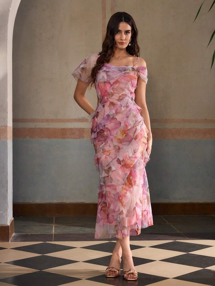 Step out in style with this Elegant Floral Print Dress, designed to turn heads with its asymmetrical shoulder and playful ruffle hem. The floral pattern adds a touch of charm, while the unique cut highlights your silhouette beautifully. Perfect for sunny days or evening outings, this dress combines comfort and flair for a delightful, feminine look.