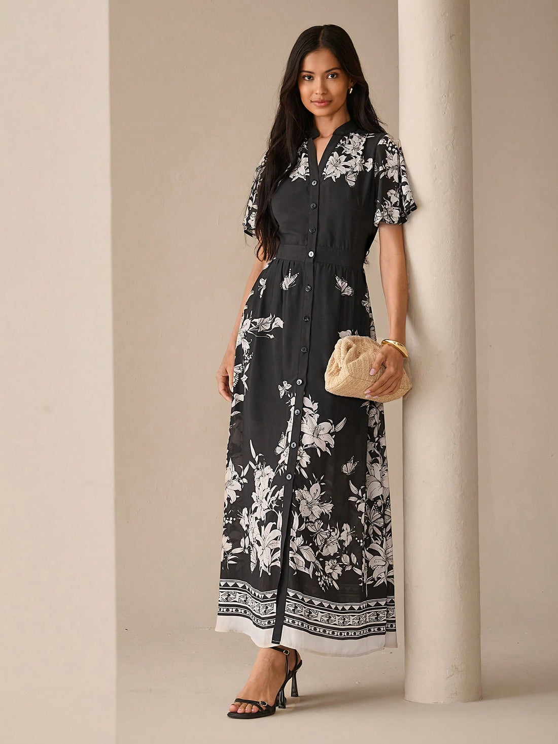 Step into summer with this playful floral print maxi dress, featuring a chic notched neck and button-front design. Its flowing silhouette keeps you cool and comfortable, perfect for sunny outings or garden parties. Embrace effortless style and let your vibrant personality bloom wherever you go.