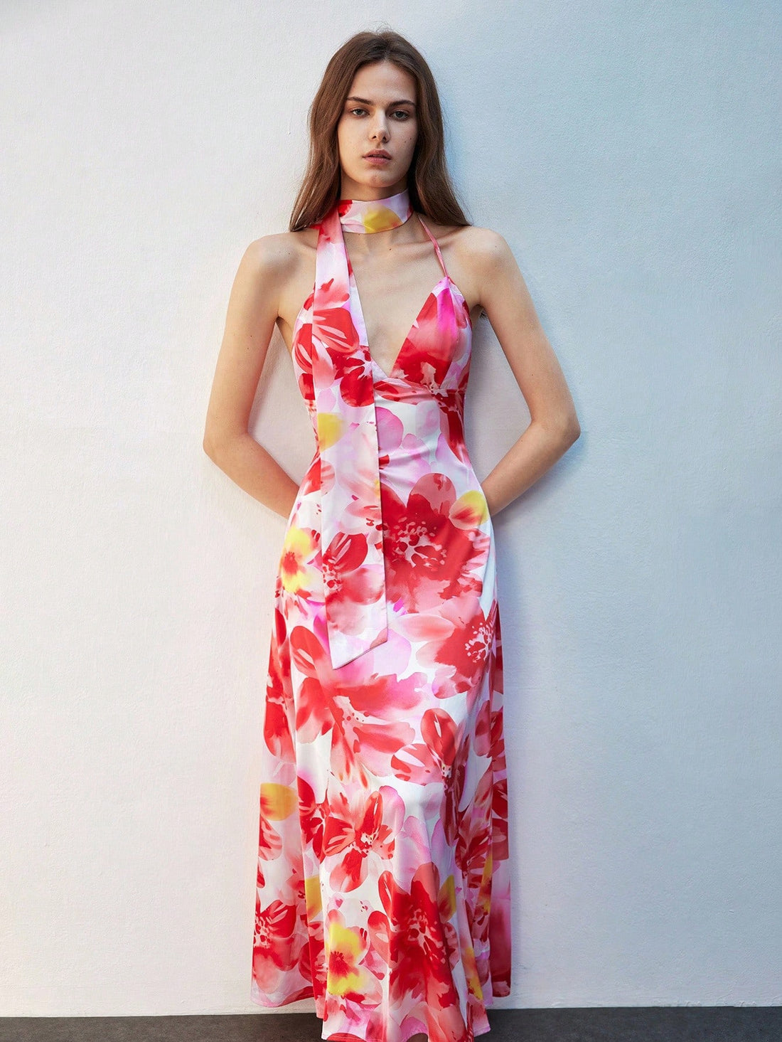 Step into the holiday spotlight with this Elegant Floral Print Maxi Halter Dress designed just for festive fun. Flowing fabric and a graceful halter neckline combine comfort with charm, making it your go-to choice for Christmas and New Year's celebrations. Bright florals and a flattering maxi length add just the right touch of whimsy to keep you dancing all night long. Celebrate in style and let your festive spirit bloom!