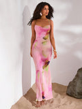 Float through summer days in this flirty floral maxi slip dress! The breezy silhouette dances with your every step, while vibrant blooms turn heads at beach parties and sunset dinners alike. Effortlessly transitions from barefoot shoreline strolls to cocktail sipping under twinkling lights. Your suitcase's new BFF for tropical getaways!