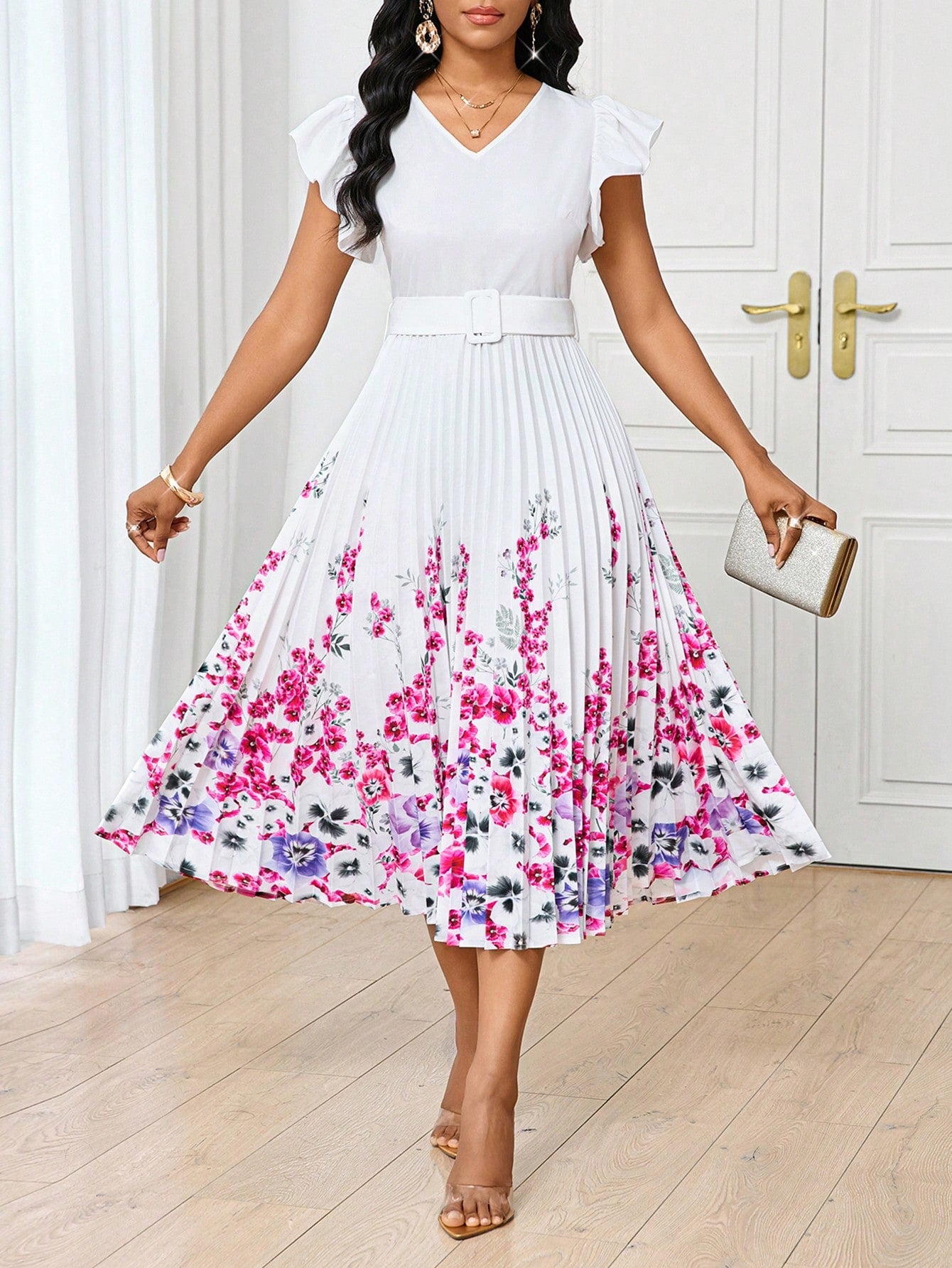 Feel pretty in this elegant floral midi dress with pleated hem and cap sleeves. Perfect for summer, this dress will make you stand out with its playful print. Its midi length adds a touch of sophistication while the cap sleeves and pleated hem keep it playful.
