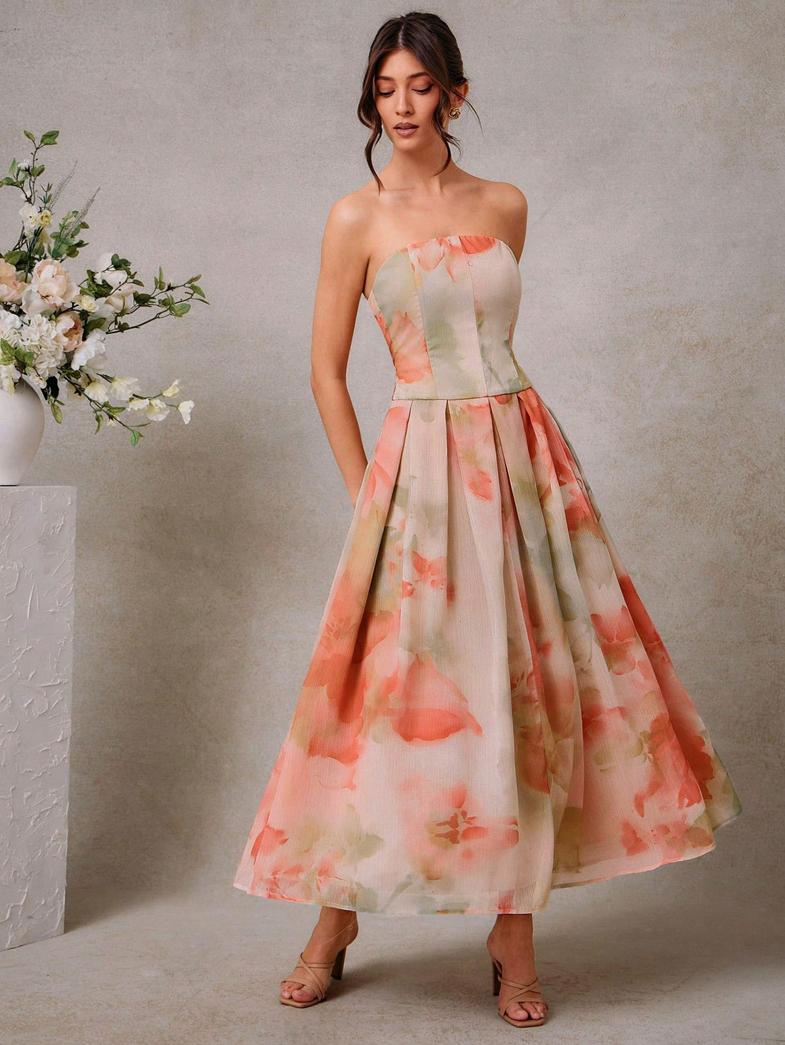 Step into summer celebrations with this Elegant Floral Print Pleated Maxi Dress, designed to turn heads at every wedding. Its flowing pleats and vibrant floral pattern make you feel like you’re dancing through a garden, while the flattering cut ensures you stay comfy and chic all day long. Perfect for twirling into the sunset or stealing the spotlight on the dance floor!