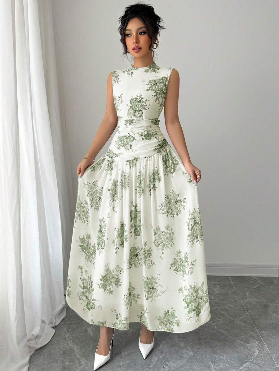 Elevate your wardrobe with this stunning floral print sleeveless dress. Featuring a sophisticated stand collar, elegant ruched waist detail, and a flattering A-line silhouette, this piece transitions seamlessly from casual to formal occasions. The high-waist design with flared hem creates a graceful, elongated look. Crafted from 100% polyester for durability and easy care, this dress is perfect for celebrations, festivals, and special events. Machine washable for convenient maintenance.