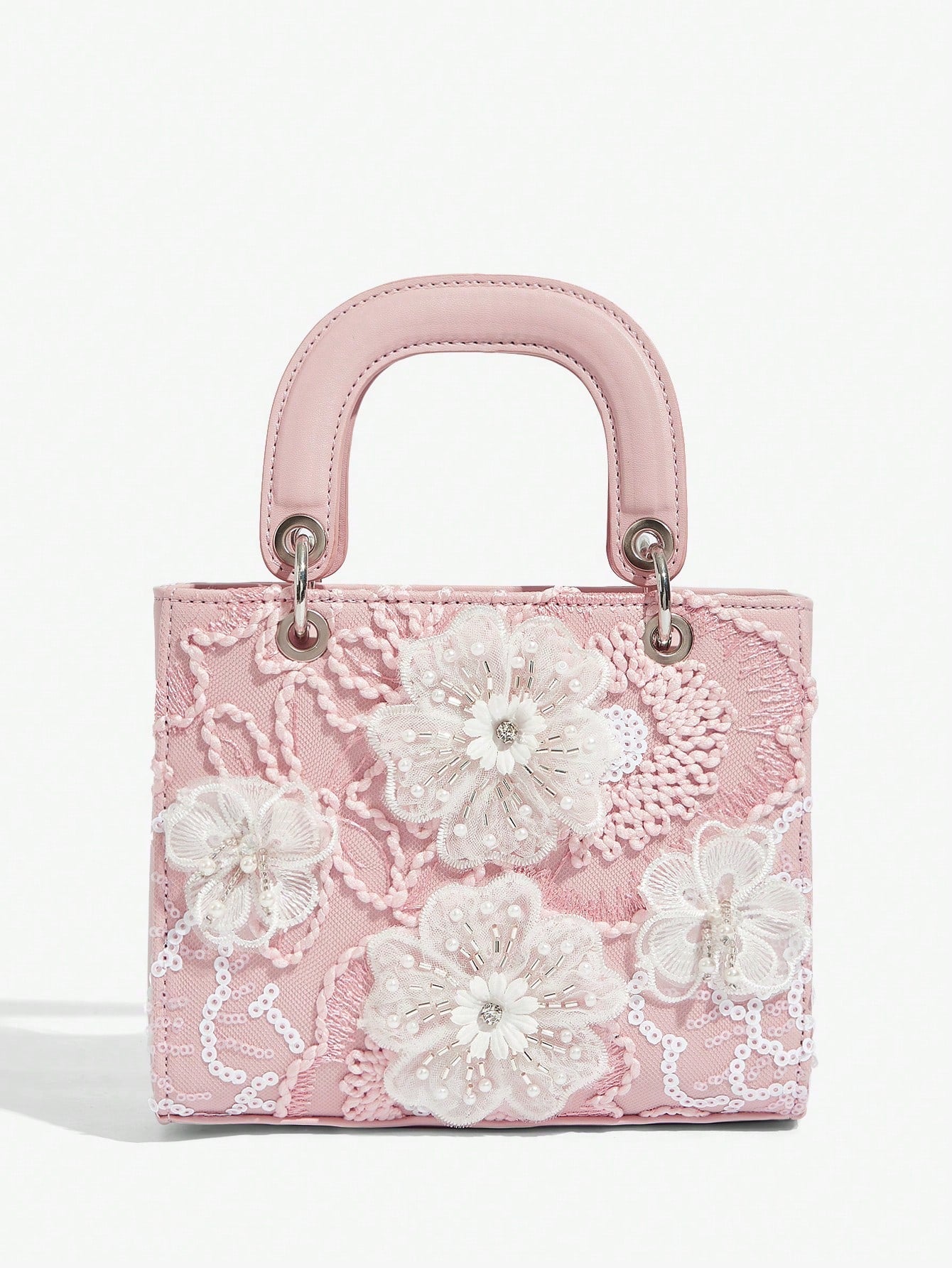 Expertly designed for elegant occasions, this Floral Top Handle Evening Bag will elevate your style at weddings, parties, and special occasions. With its delicate floral details and convenient top handle, this bag is both beautiful and practical. Make a statement with this must-have accessory.