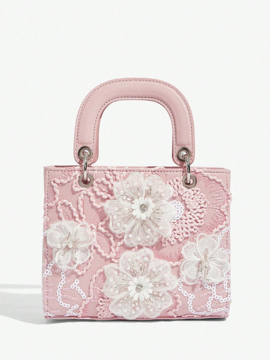 Expertly designed for elegant occasions, this Floral Top Handle Evening Bag will elevate your style at weddings, parties, and special occasions. With its delicate floral details and convenient top handle, this bag is both beautiful and practical. Make a statement with this must-have accessory.