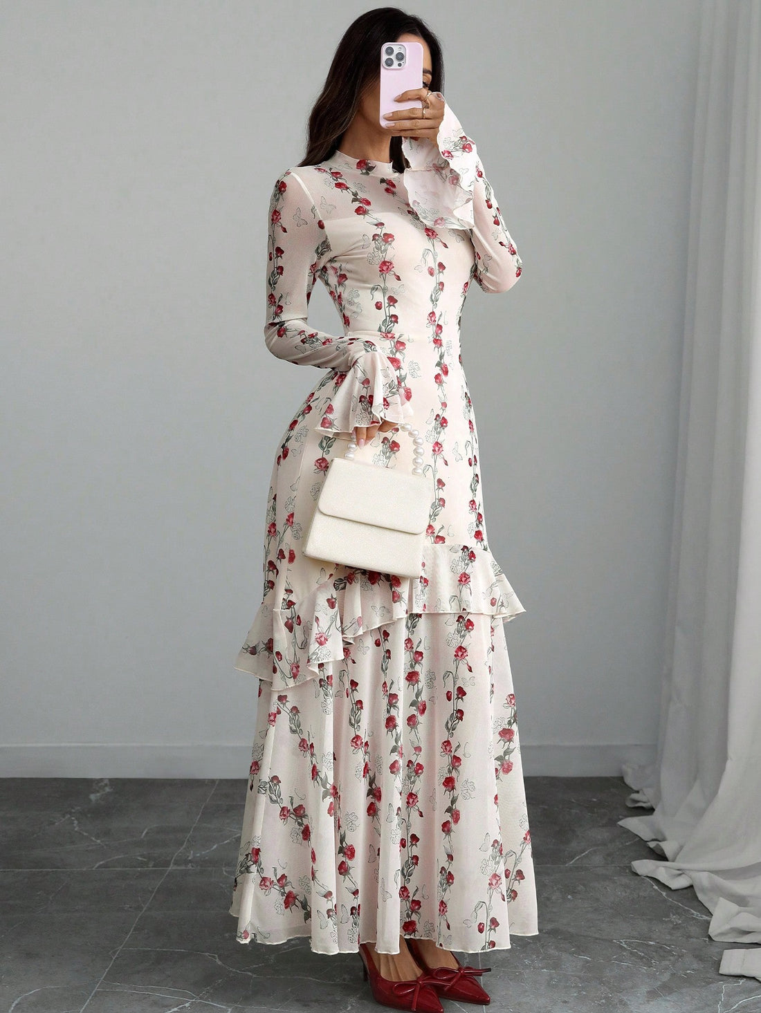 Bonjour! Here's your product description: Ooh là là! This charming dress brings a touch of Parisian whimsy straight to your wardrobe. Delicate ruffles cascade down the bodice while floral-adorned sleeves add a romantic flourish. The playful asymmetrical hem creates movement and intrigue with every step—perfect for twirling at brunch or making a graceful entrance at any occasion. Effortlessly chic and undeniably French-inspired, this dress is your ticket to looking effortlessly elegant while having all the f