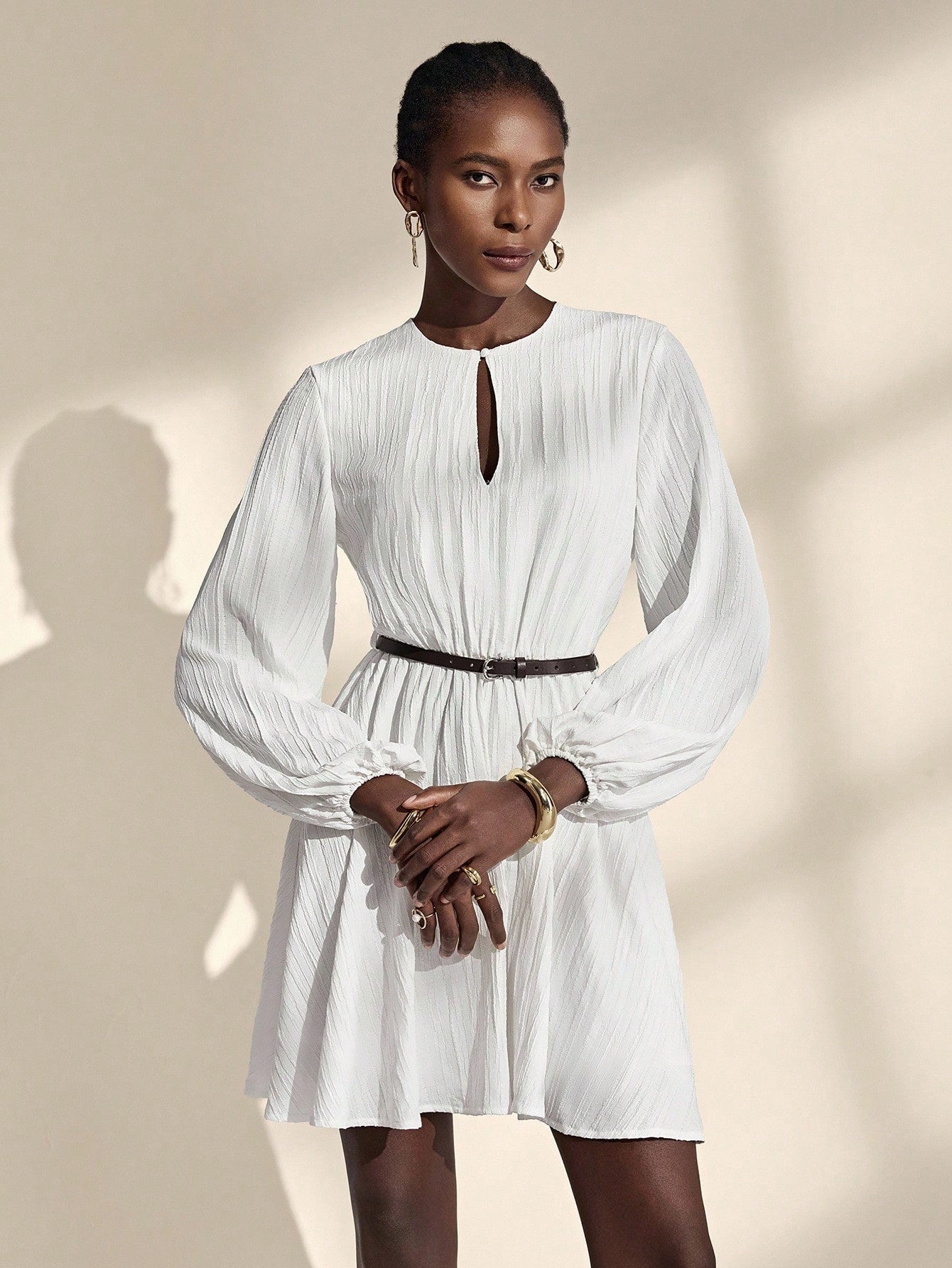 Twirl into romance with this enchanting white dress that whispers elegance at every turn. The dreamy lantern sleeves add a touch of whimsy and vintage charm, while the refined silhouette flatters effortlessly. Crafted with a French-inspired aesthetic, this versatile piece transitions seamlessly from crisp autumn days to breezy spring afternoons. Whether you're strolling through gardens or attending a special gathering, this dress captures that magical je ne sais quoi that makes you feel absolutely fabulous.