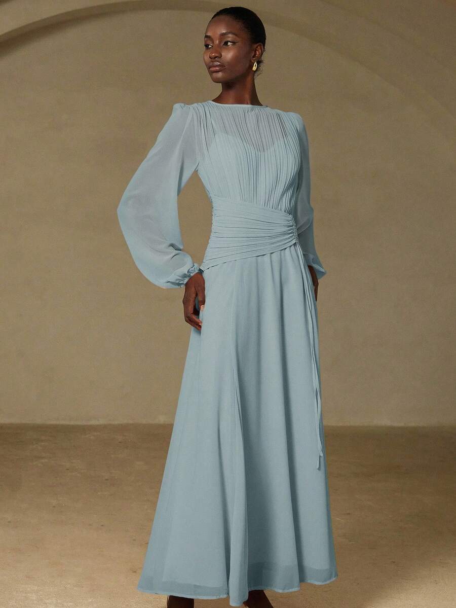 Bonjour, darling! Step into timeless Parisian elegance with this show-stopping maxi dress. The asymmetric drawstring waist cinches your silhouette with effortless chic, while delicate pleats add movement and dimension throughout. Crafted in the spirit of vintage French fashion, this piece whispers sophistication whether you're strolling through the city or turning heads at an evening soirée. Perfect for those who believe fashion should be both playful and polished. Oui, c'est magnifique!