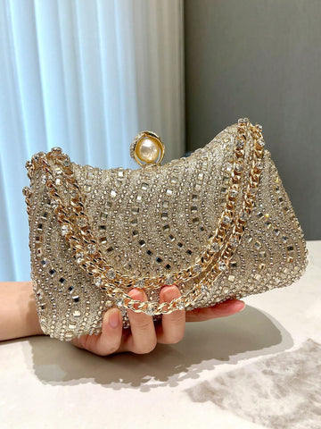 Make a statement at any event with our Elegant Gold Foil Stamped Clutch Bag. The stunning rhinestone accents add a touch of glamour, making it perfect for parties, weddings, and formal occasions. Expertly crafted with attention to detail, this clutch bag is sure to elevate any outfit.