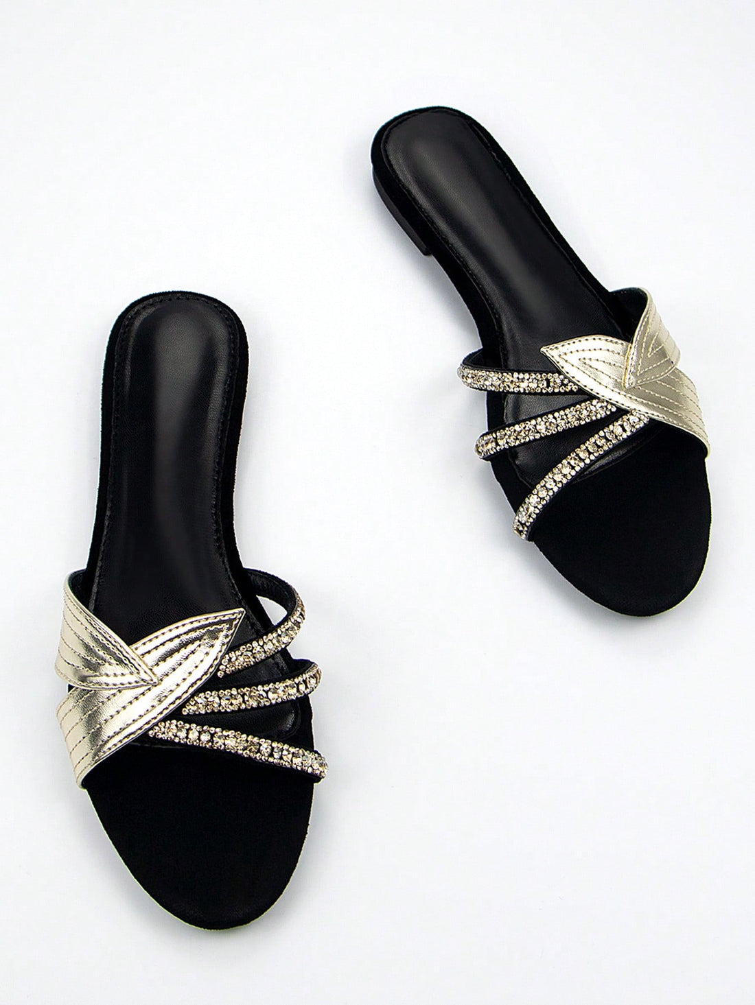 Step into style with our Black Velvet Mules that bring the party wherever you go! These sassy slip-ons feature dazzling gold leaf appliques and eye-catching rhinestones that'll make your feet the talk of the town. Comfy enough for everyday strutting but fancy enough for your wildest nights out – because who says you can't have fun AND fabulous feet?