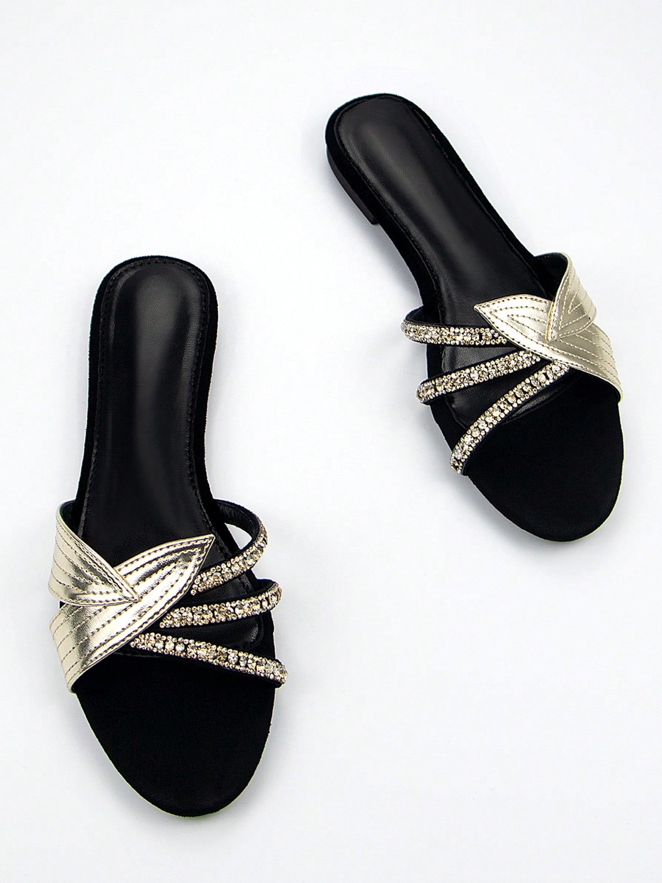 Step into style with our Black Velvet Mules that bring the party wherever you go! These sassy slip-ons feature dazzling gold leaf appliques and eye-catching rhinestones that'll make your feet the talk of the town. Comfy enough for everyday strutting but fancy enough for your wildest nights out – because who says you can't have fun AND fabulous feet?