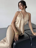 Slip into pure glamour with this stunning gold satin halter dress that's ready to turn heads at any event. The silky smooth fabric drapes beautifully while the daring backless design adds just the right amount of allure and sophistication. Perfect for parties, galas, or those nights when you want to feel absolutely fabulous. This versatile piece transitions seamlessly from cocktail hour to dancing the night away. Elevate your evening wardrobe with a dress that's equal parts elegant and unforgettable.