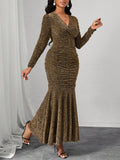 Step into the spotlight this Christmas with our Elegant Golden V-Neck Fishtail Dress. Its shimmering gold fabric and flattering V-neckline create a dazzling look, while the fishtail silhouette adds a fun, flirty flair to your party style. Perfect for twirling under the holiday lights and making every moment sparkle!