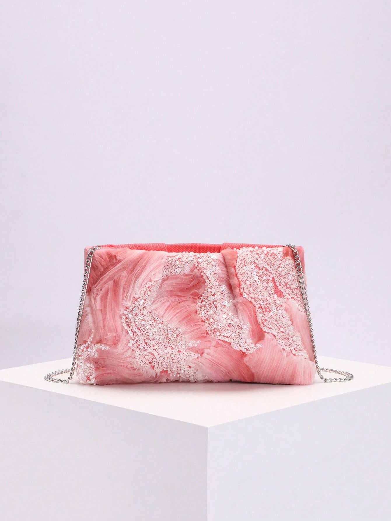 Add a splash of charm to your special occasions with this Elegant Gradient Pink Pleated Mesh Clutch Bag. Featuring delicate pearl sequins and a soft gradient pink hue, it’s the perfect playful accessory to brighten weddings and parties while keeping your essentials close in style.