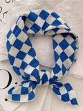 Elevate your spring and autumn wardrobe with this elegant green ditsy floral chiffon square scarf. Crafted from lightweight, breathable chiffon, it drapes beautifully around your neck as a sophisticated neckerchief or styled as a headscarf for versatile everyday wear. The delicate floral print in soft green tones adds a feminine touch to any outfit, from casual to polished looks. Perfect for layering over dresses, blouses, or jackets, this timeless accessory transitions seamlessly through seasons. 