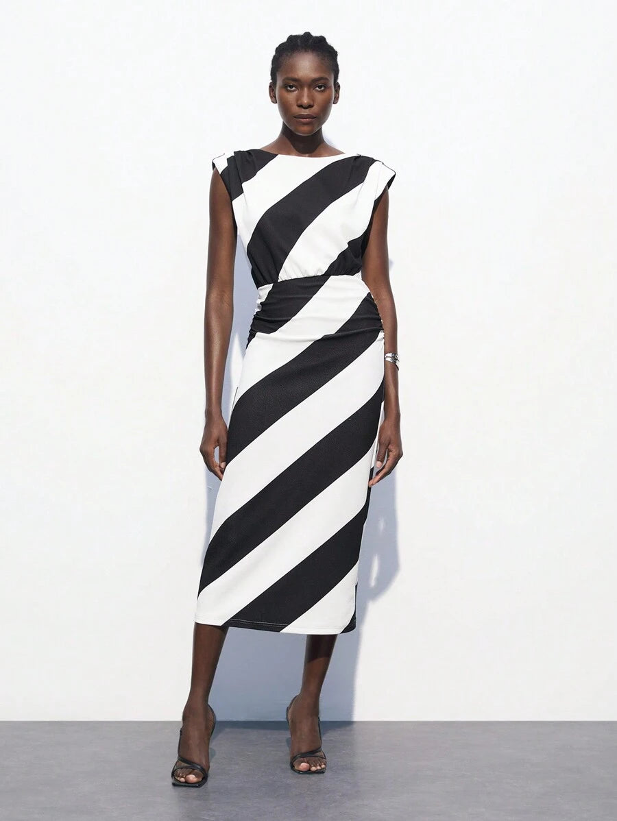 Stripes never go out of style—especially when they're this chic! This green and white striped dress features a flattering waist-cinching design that creates an instantly polished silhouette. Perfect for transitioning from summer into fall, it's your go-to piece for business-casual settings where you want to look put-together without trying too hard. Pair it with sneakers for a relaxed vibe or dress it up with heels for the office. Versatile, timeless, and undeniably elegant.