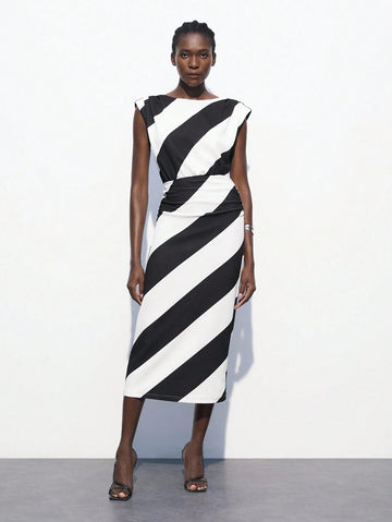 Stripes never go out of style—especially when they're this chic! This green and white striped dress features a flattering waist-cinching design that creates an instantly polished silhouette. Perfect for transitioning from summer into fall, it's your go-to piece for business-casual settings where you want to look put-together without trying too hard. Pair it with sneakers for a relaxed vibe or dress it up with heels for the office. Versatile, timeless, and undeniably elegant.