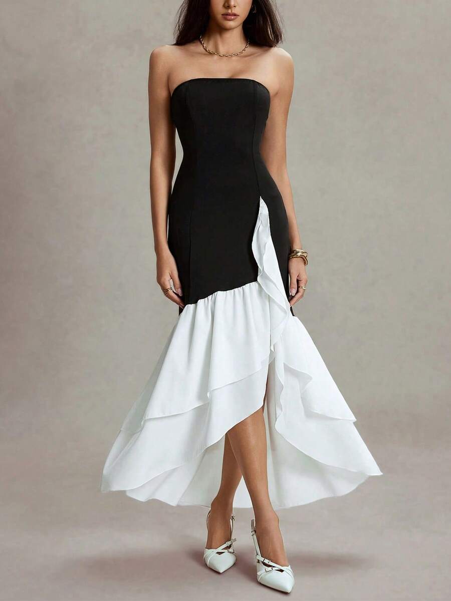 Make a statement in this stunning halter color block fishtail maxi dress that's equal parts glamorous and fun. The structured corset bodice cinches your waist beautifully while the contrasting color blocks add modern flair. That dramatic fishtail hem? Pure showstopper energy. Whether you're heading to a formal gala, wedding, or special celebration, this dress delivers elegance with a playful twist. The halter neckline flatters while keeping things sophisticated, and the flowing maxi silhouette ensures you'l