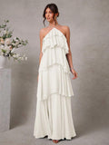 Turn heads at any wedding with this Elegant Halter Neck Tiered Chiffon Maxi Dress. Its flowing chiffon and tiered layers create a dreamy silhouette that dances with every step. The halter neck adds a flirty touch, making it perfect for romantic celebrations. Feel effortlessly graceful and ready to mingle all night in this charming maxi dress designed for memorable moments.