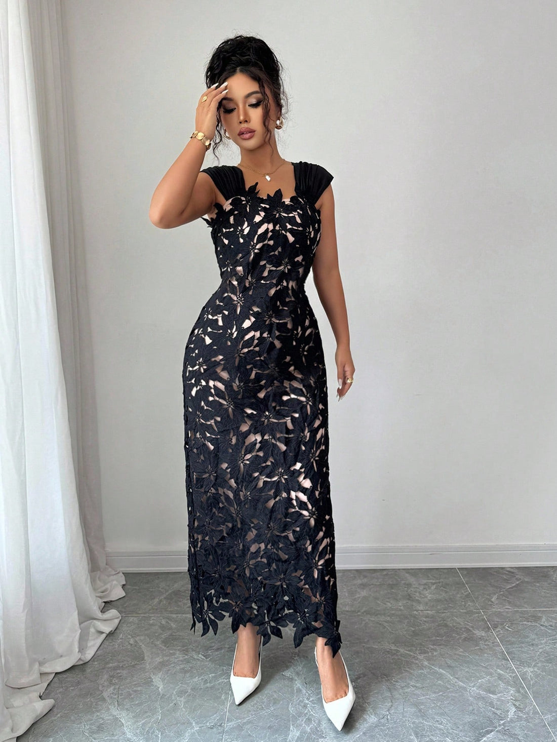 Make a statement at your next formal affair in this stunning black evening dress. Intricate floral embroidery adorns the silhouette while strategic hollow-out details add modern sophistication and visual intrigue. The refined design flatters your figure while the luxe fabric drapes beautifully, ensuring you'll feel as fabulous as you look. Perfect for galas, weddings, and upscale celebrations where elegance meets edge.