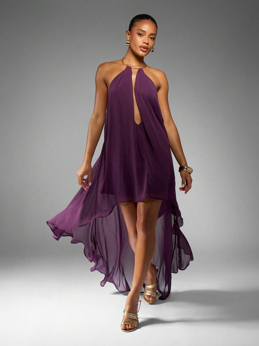 Make a statement at your next special occasion in this stunning purple chiffon maxi dress. Featuring an elegant draped halter neckline and flattering high-low hemline, this piece combines sophistication with modern flair. The backless design and asymmetrical cut create a graceful silhouette, while the A-line shape ensures comfortable movement. Crafted from 100% polyester with a lined interior, this dress transitions beautifully from summer weddings to evening celebrations. The loose fit accommodates all bod
