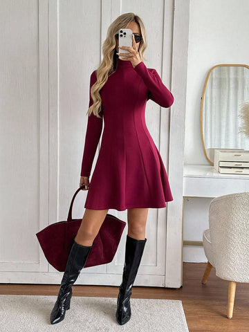 Step into timeless elegance with this stunning wine-hued midi dress that effortlessly blends retro charm with modern sophistication. The graceful A-line silhouette flatters every figure, while the high neckline and long sleeves deliver a polished, put-together look perfect for brunch dates, casual outings, or cozy gatherings. Crafted for comfort and style, this versatile piece transitions seamlessly from day to night, making it a wardrobe essential that'll have you feeling fabulous no matter the occasion.