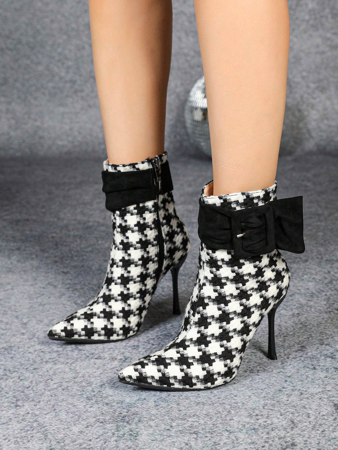 Step out in style with these Elegant Houndstooth High Heel Booties, complete with a stylish zipper detail. Perfect for a night out or adding some flair to your work wardrobe. You'll turn heads and feel confident in these unique and fashionable booties!