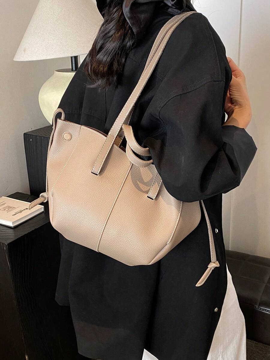 Add a touch of chic charm to your outfit with this Elegant Korean Niche Pleated Shoulder Bag. Its playful pleated design and roomy interior make it perfect for carrying all your essentials in style. Whether you're heading to brunch or a day out, this luxurious tote combines fashion and function effortlessly.
