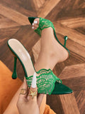 Green leaf-lace pointed open-toe mule with glossy base and flared stiletto heel