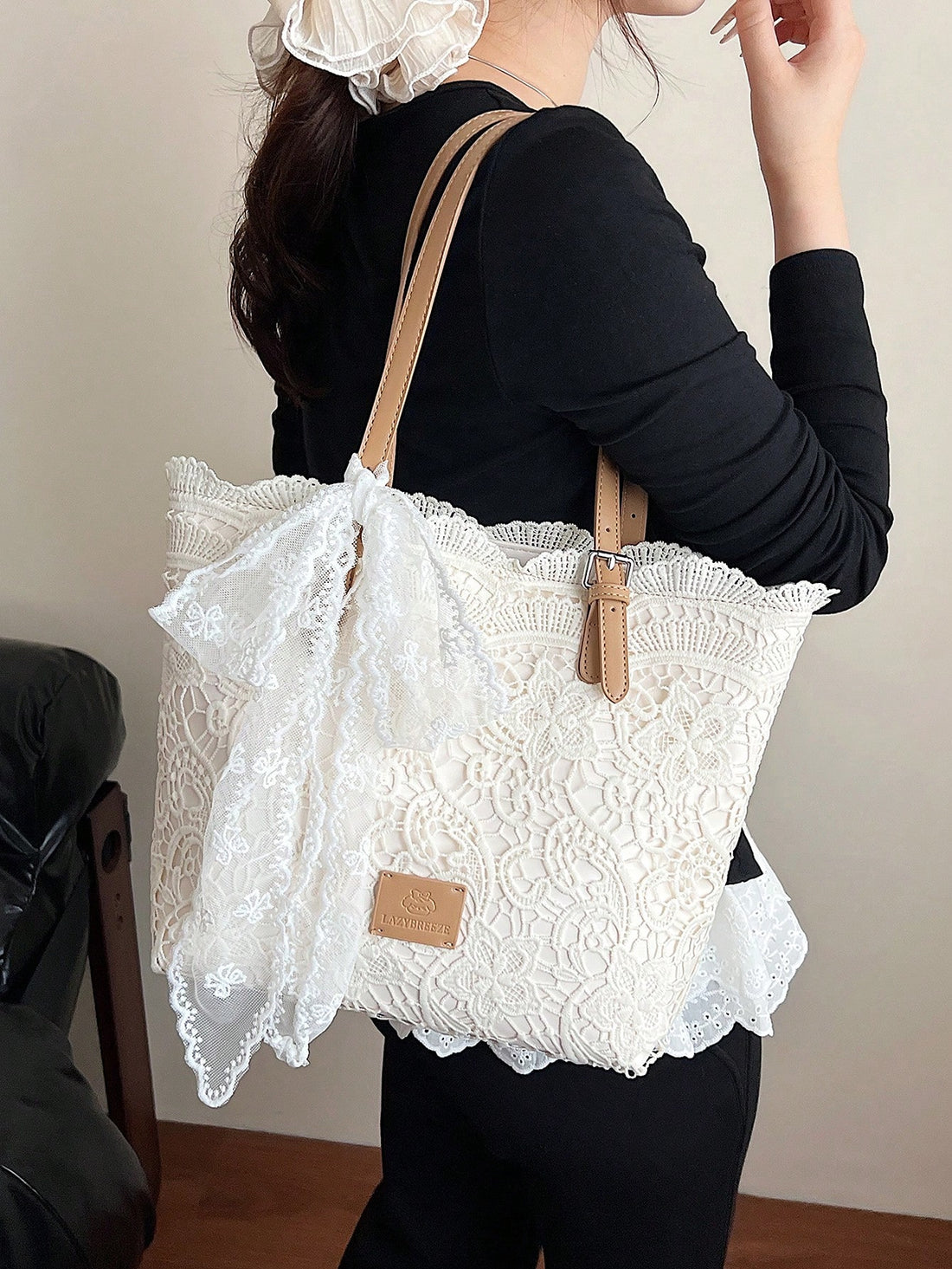 Carry your essentials in timeless style with this elegant lace tote bag, perfect for vacations and casual outings. Featuring delicate lace detailing and a charming bow accent, this medium-sized shoulder bag combines sophistication with practicality. The high-capacity design accommodates everything you need, while the secure zipper closure keeps your belongings safe. Crafted from durable 100% polyester with comfortable double handles, this beige tote transitions effortlessly from beach days to city adventure