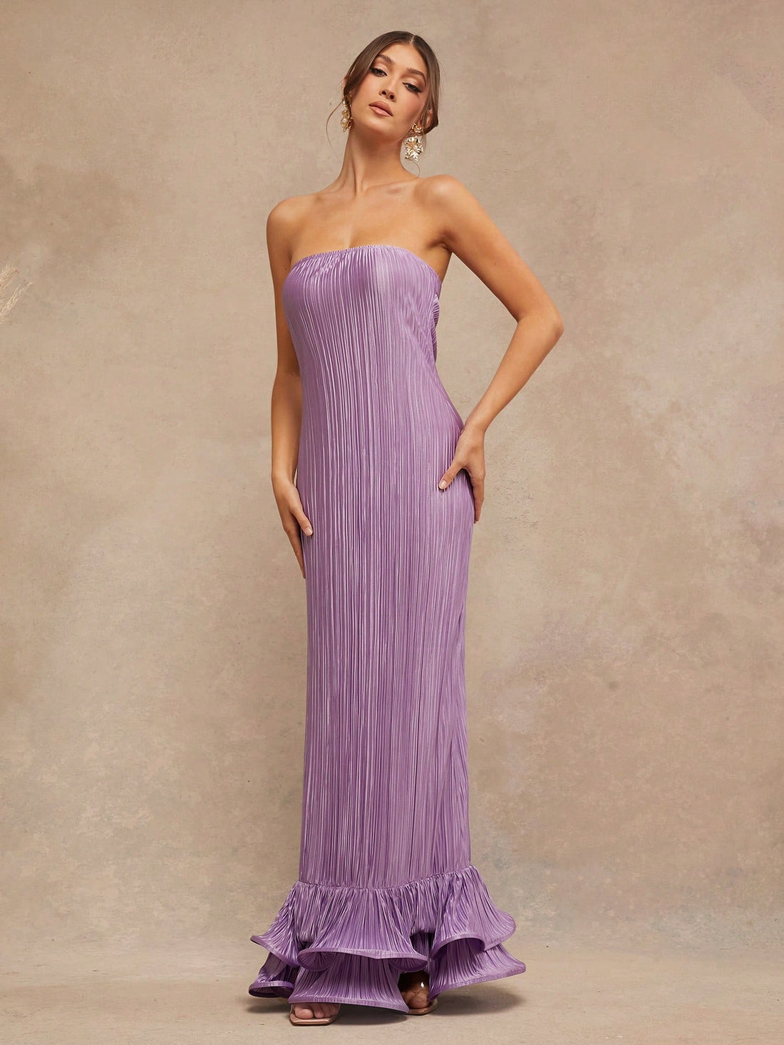 Be the life of the party in our Elegant Lavender Peplum Ruffle Hem Dress! Featuring a stunning open back, this dress is perfect for any special occasion. From weddings to date nights, you'll turn heads and feel confident in this unique piece. Say YES to the dress!