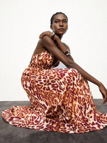 Turn heads in this stunning leopard print maxi dress that effortlessly blends wild style with elegant sophistication. The daring backless design creates an eye-catching silhouette perfect for making a statement at parties or lounging by the pool during vacation. Flowing fabric drapes beautifully while the classic leopard pattern adds that perfect touch of sass and personality. Whether you're dancing the night away or soaking up the sun, this versatile piece transitions seamlessly from casual getaway essenti