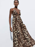 Turn heads in this stunning leopard print maxi dress that's equal parts wild and sophisticated. The daring backless design creates an effortlessly chic silhouette, while the flowing fabric moves beautifully whether you're strolling the beach, dancing at a party, or soaking up vacation vibes. This versatile piece transitions seamlessly from day to night—throw on sandals for casual elegance or pair with heels for an unforgettable evening look. The timeless leopard pattern adds just the right amount of sass to